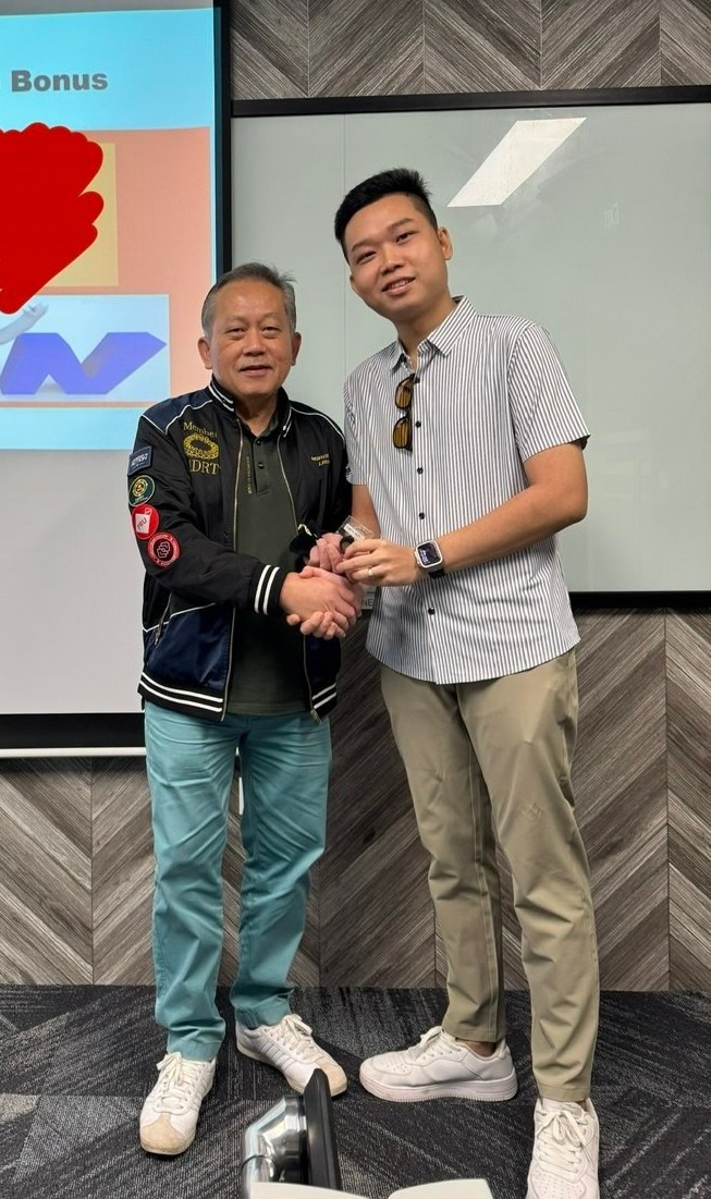 Alvin receiving an award