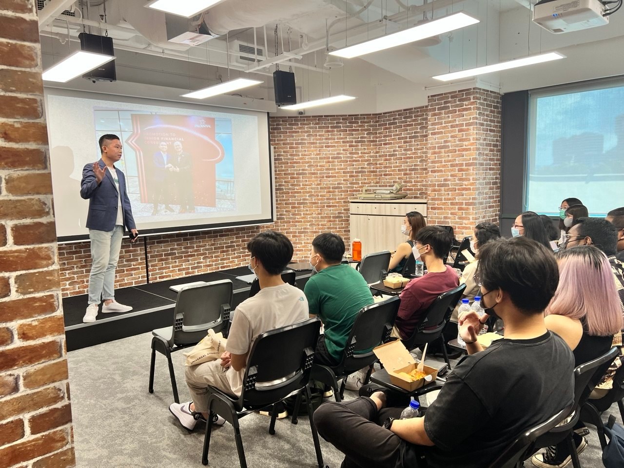 Alvin speaking to a room